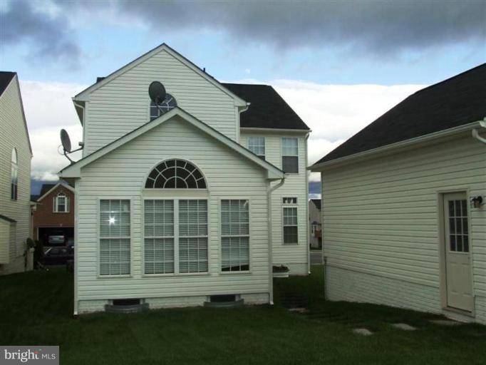 1307 Stallion Street Ranson, WV 25438 - Photo 21 of 22 a front view of a house with a garden