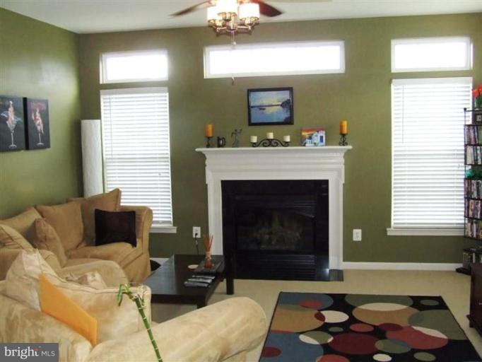 1307 Stallion Street Ranson, WV 25438 - Photo 4 of 22 a living room with furniture and a fireplace