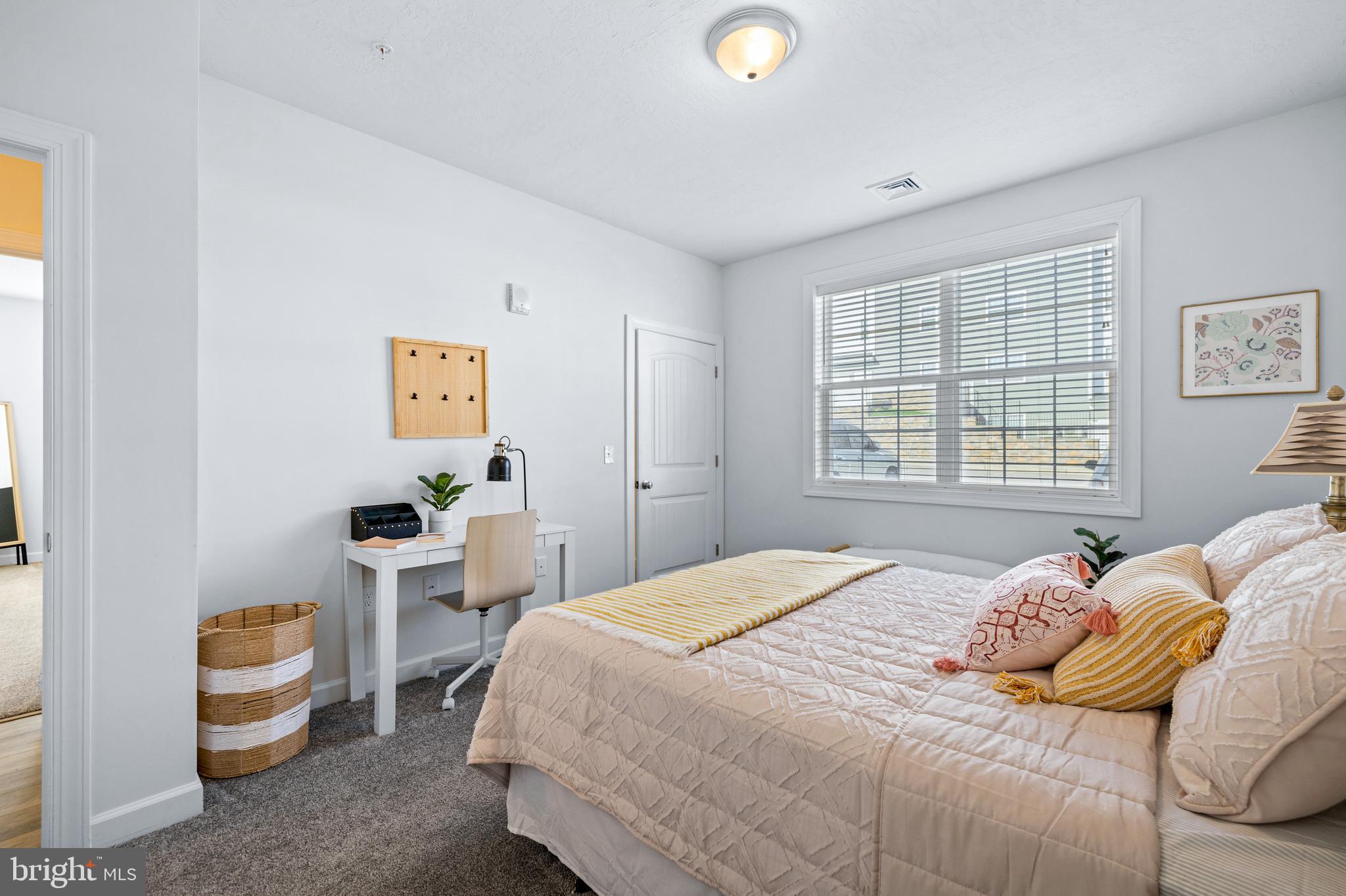1201 Walnut Bottom Road, Unit 130307 Carlisle, PA 17015 - Photo 17 of 32 a bedroom with a bed and a window
