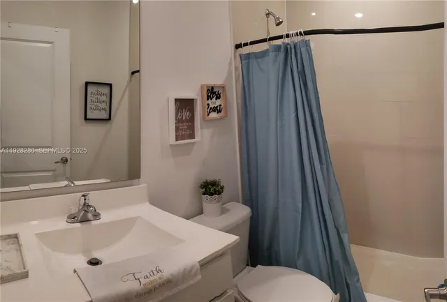 a bedroom with a bed and a table in it