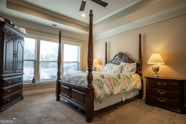 a bed room with a bed and a night stand