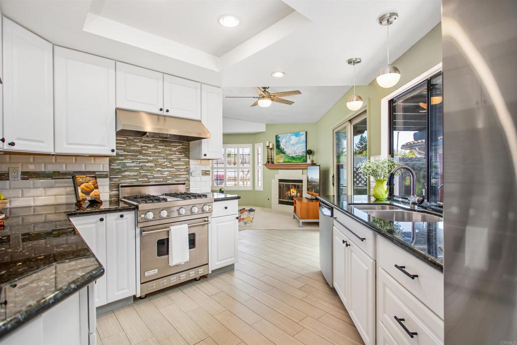 5312 Ontario Street Oceanside, CA 92056 - Photo 11 of 48 a kitchen with stainless steel appliances granite countertop a stove and cabinets