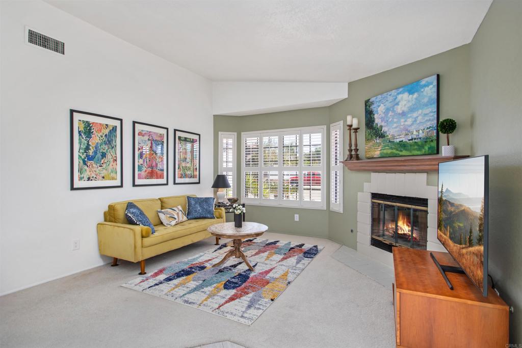 5312 Ontario Street Oceanside, CA 92056 - Photo 19 of 48 a living room with furniture and a fireplace