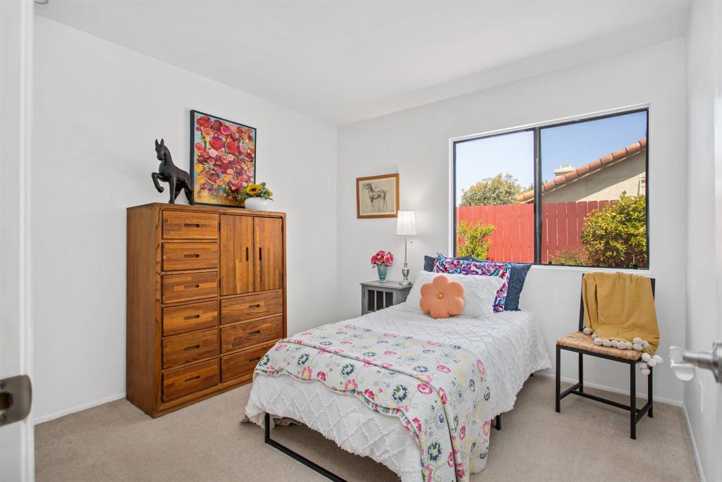 5312 Ontario Street Oceanside, CA 92056 - Photo 28 of 48 a bedroom with a bed a dresser and a window