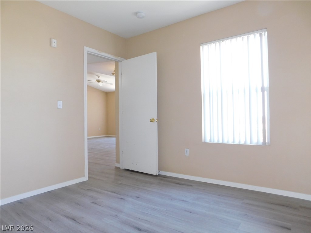 7255 West Sunset Road, Unit 2029 Las Vegas, NV 89113 - Photo 18 of 21 This naturally illuminated bedroom offers versatile space with durable flooring and an open doorway leading to another area.