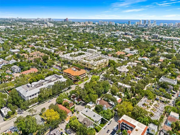 an aerial view of residential building with green space