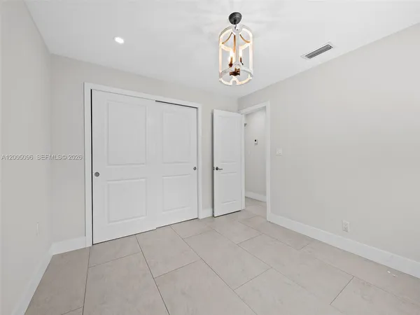 a view of a storage & utility room with a window