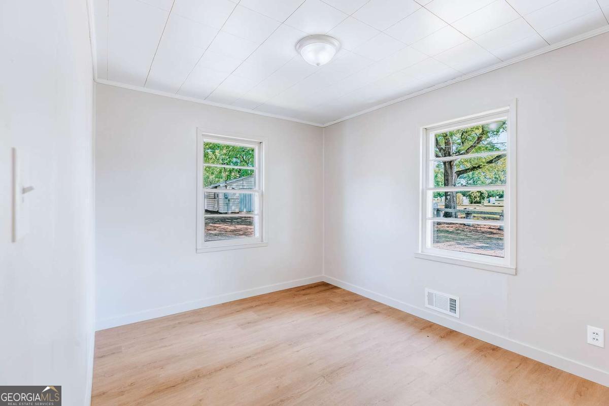 52 Clark Circle Lexington, GA 30648 - Photo 16 of 47 an empty room with a window