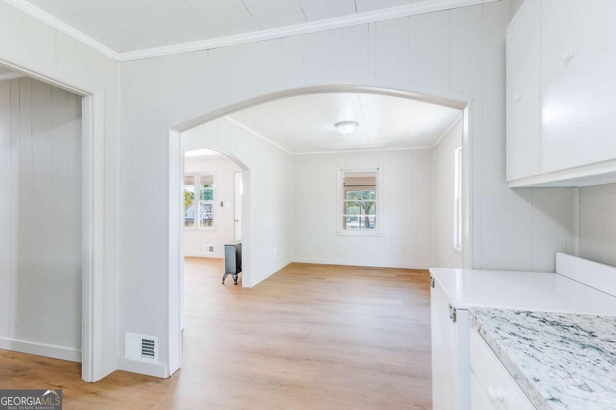 52 Clark Circle Lexington, GA 30648 - Photo 18 of 47 an empty room with windows and cabinet