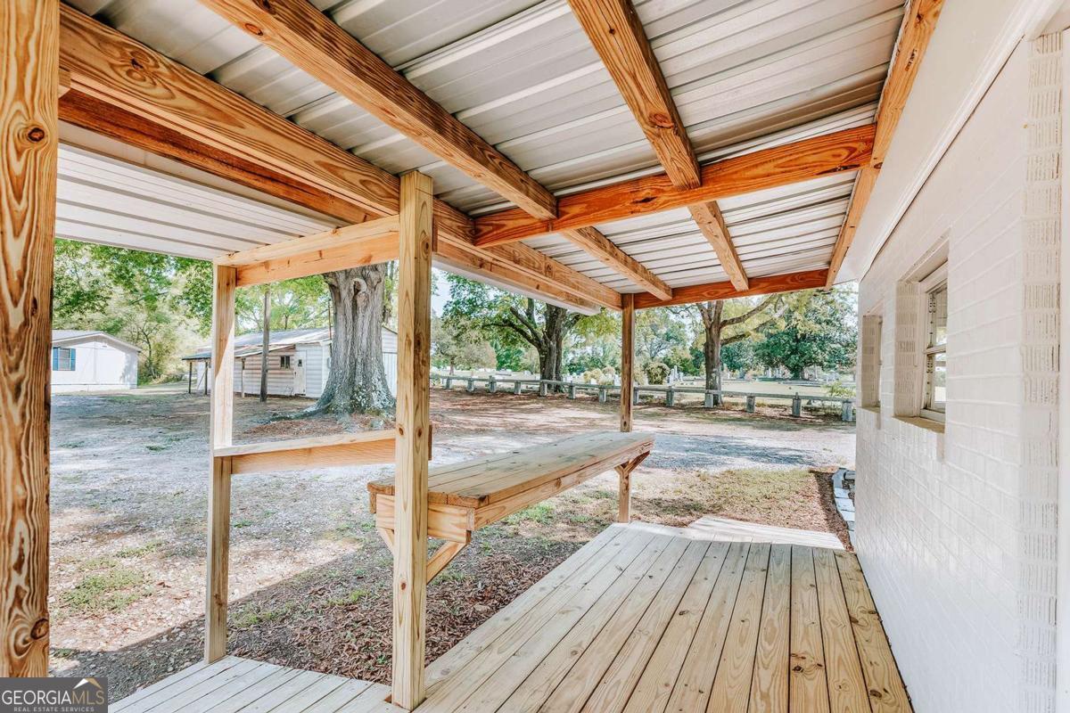 52 Clark Circle Lexington, GA 30648 - Photo 20 of 47 a view of porch with wooden floor