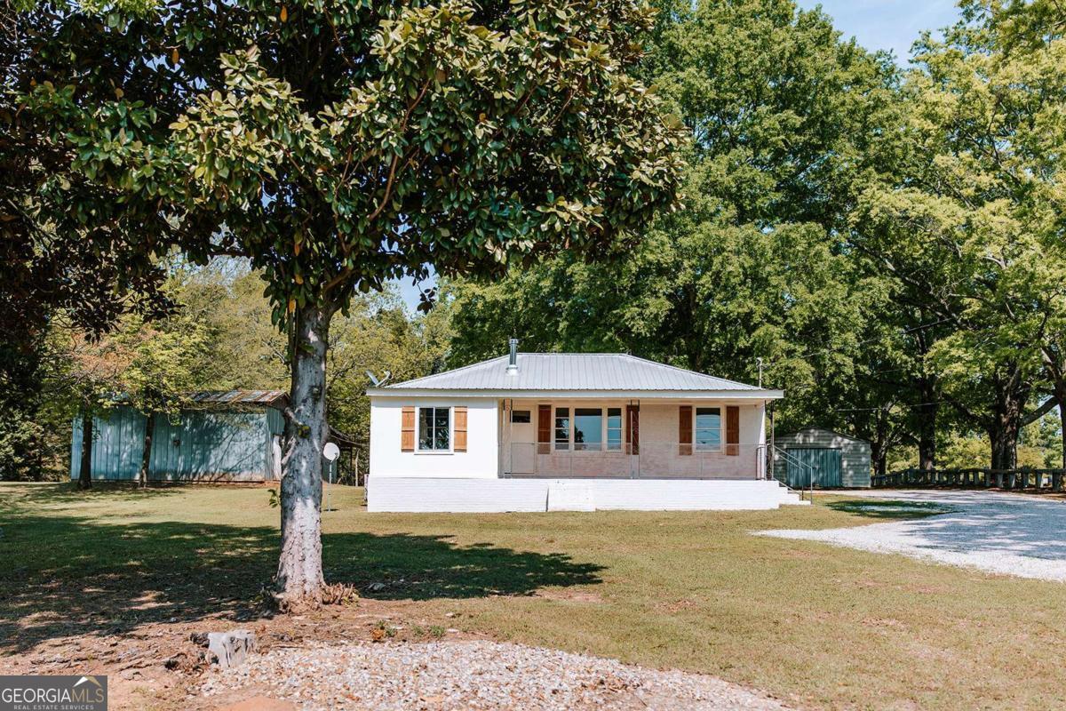 52 Clark Circle Lexington, GA 30648 - Photo 2 of 47 a front view of a house with a yard