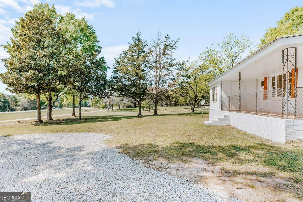 52 Clark Circle Lexington, GA 30648 - Photo 23 of 47 a view of a yard with a tree