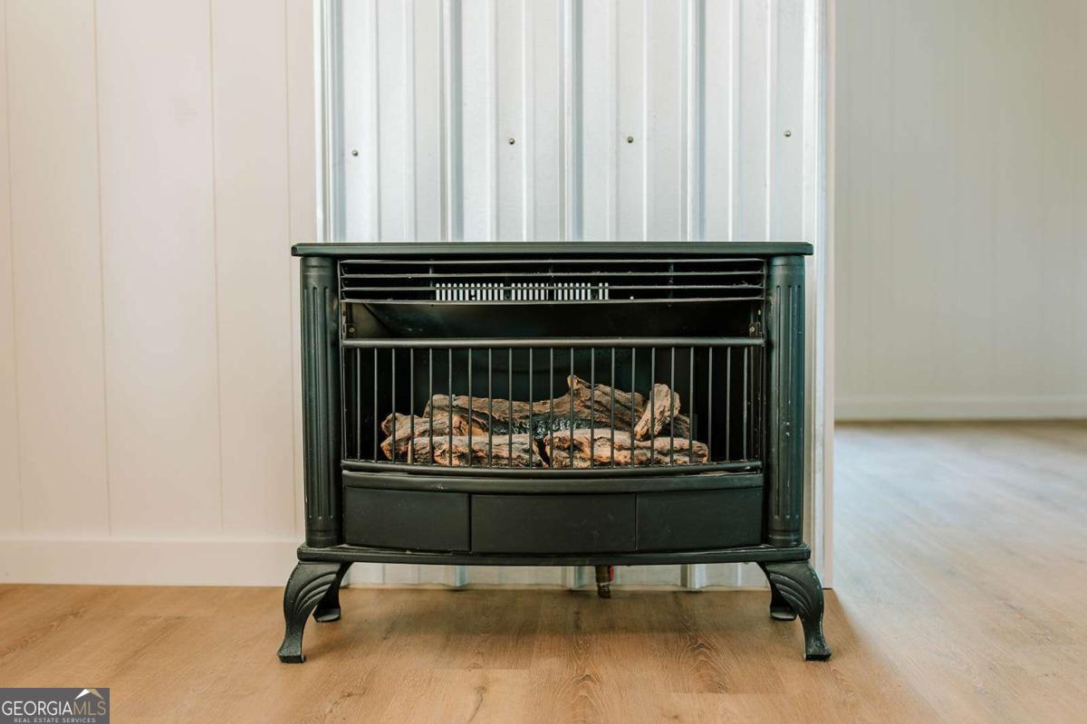 52 Clark Circle Lexington, GA 30648 - Photo 26 of 47 a living room with furniture and a fireplace