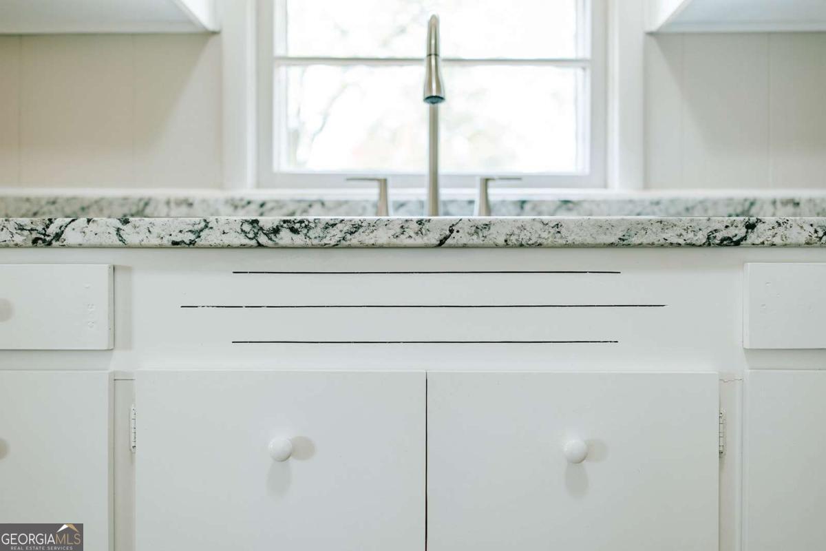 52 Clark Circle Lexington, GA 30648 - Photo 28 of 47 a bathroom with a granite countertop sink and window