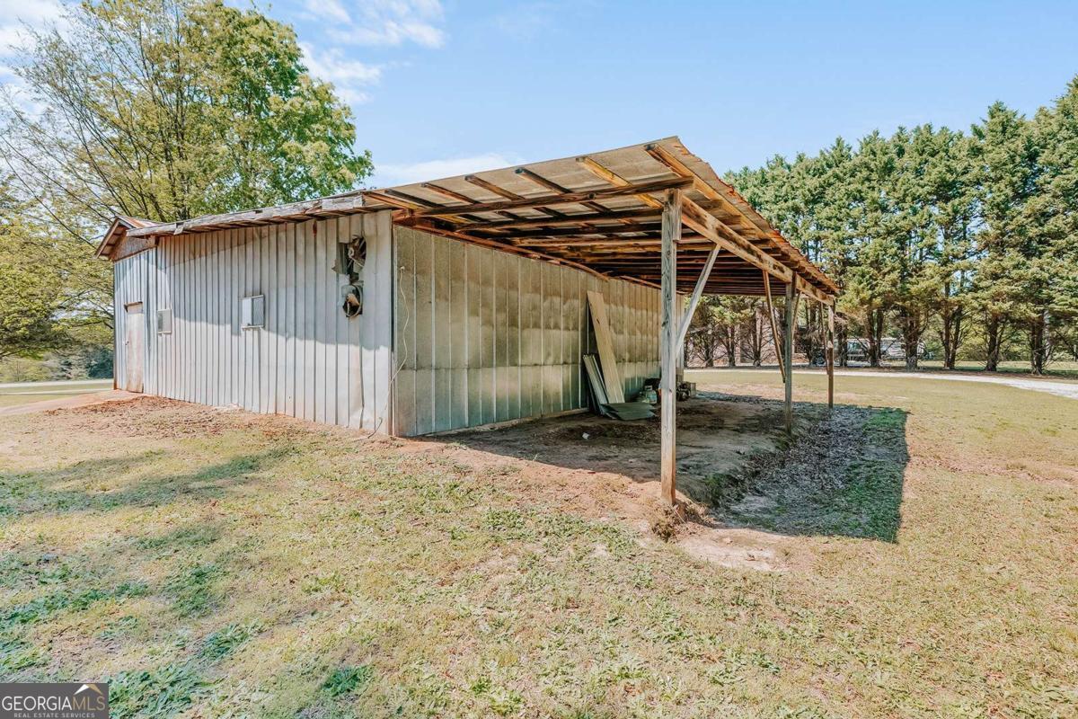 52 Clark Circle Lexington, GA 30648 - Photo 36 of 47 a backyard of a house with wooden fence