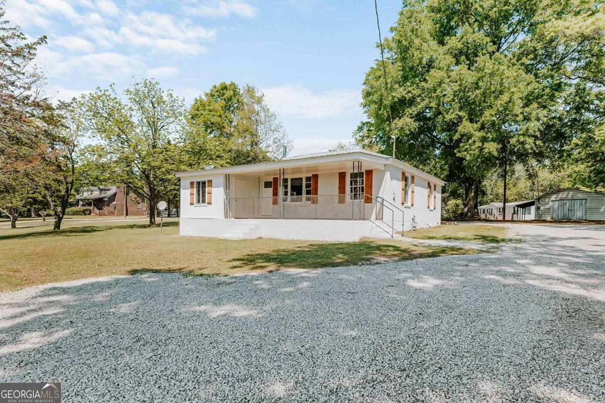 52 Clark Circle Lexington, GA 30648 - Photo 4 of 47 a view of house with outdoor space and street view