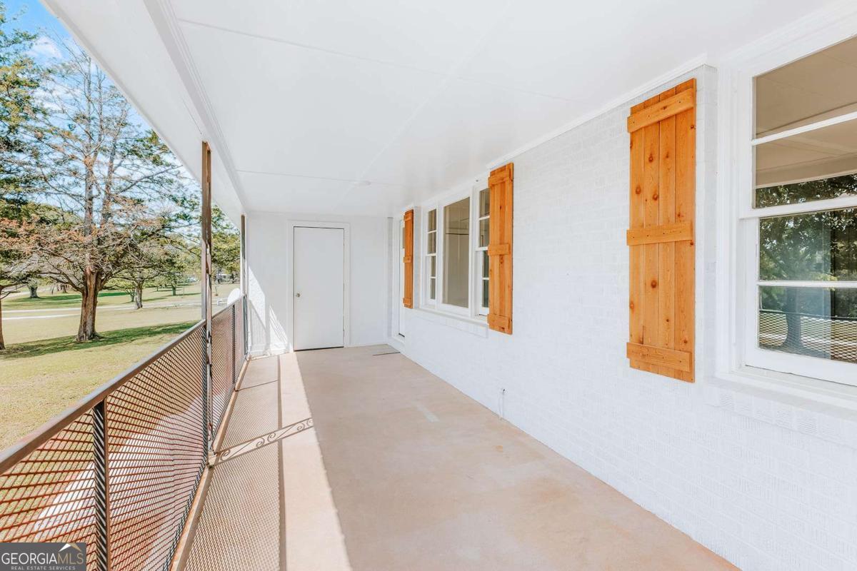 52 Clark Circle Lexington, GA 30648 - Photo 7 of 47 a view of a house with wooden floor and windows