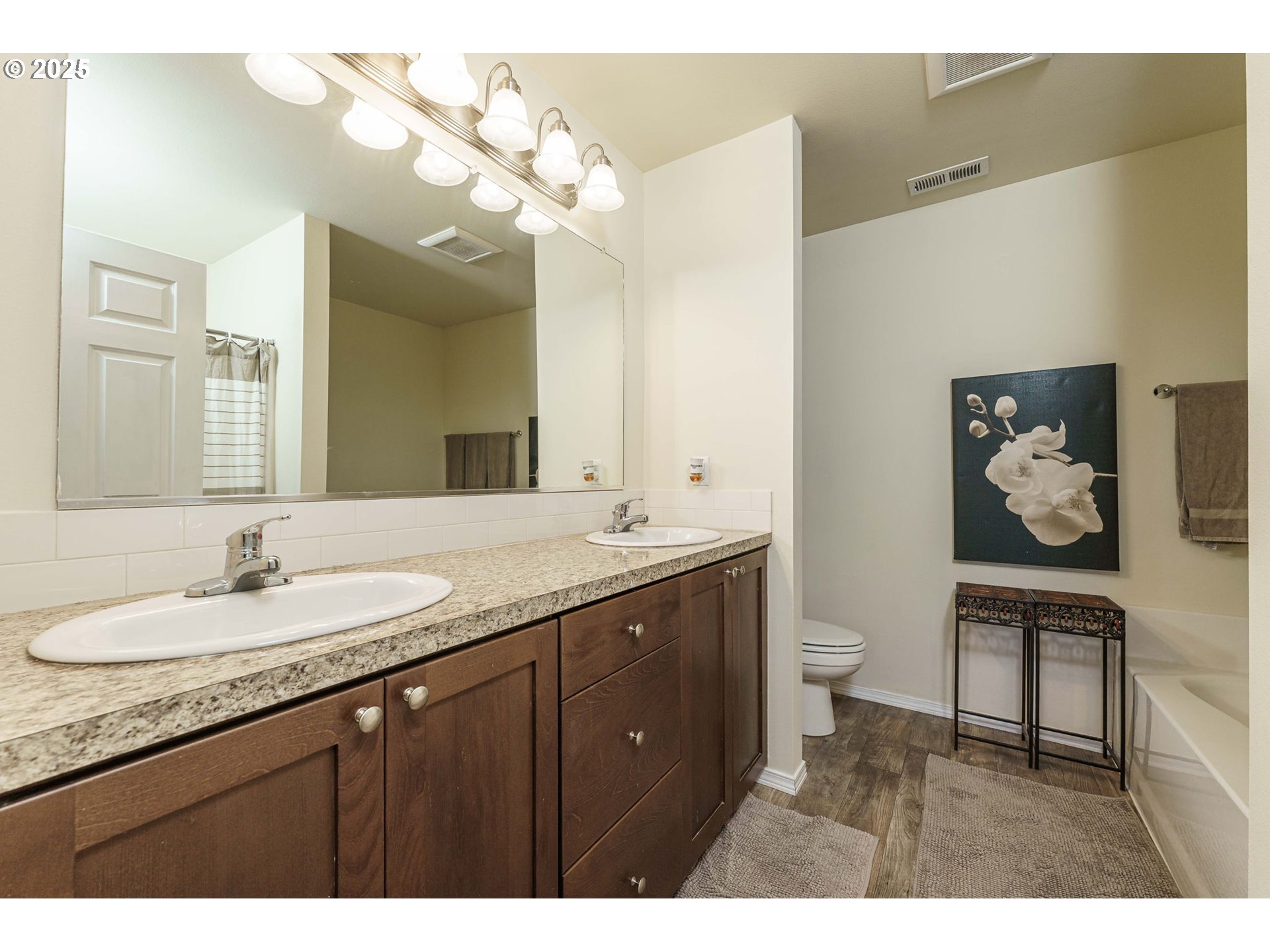282 Karousel Lane Washougal, WA 98671 - Photo 21 of 42 a bathroom with a granite countertop sink a toilet and a mirror