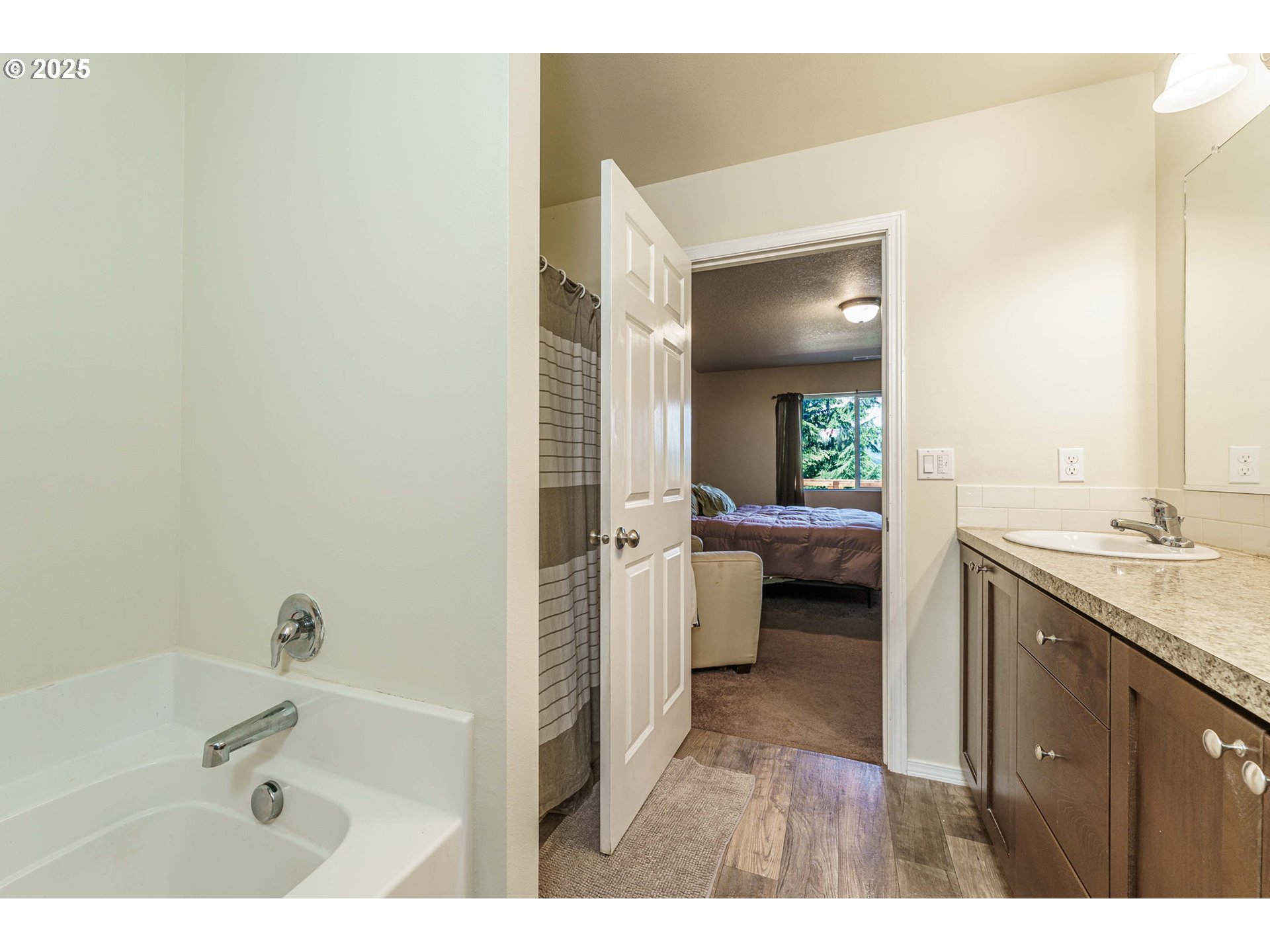 282 Karousel Lane Washougal, WA 98671 - Photo 22 of 42 a en suite bathroom with a tub sink and mirror