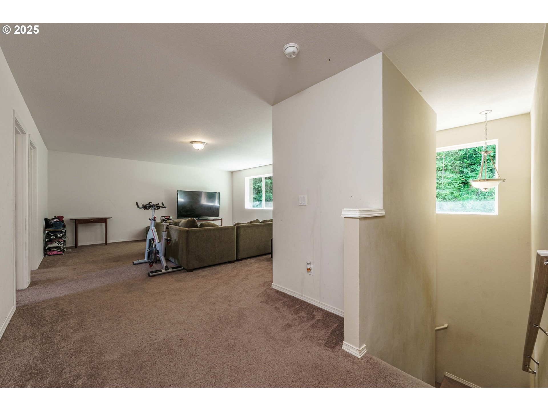 282 Karousel Lane Washougal, WA 98671 - Photo 24 of 42 a living room with furniture and a flat screen tv