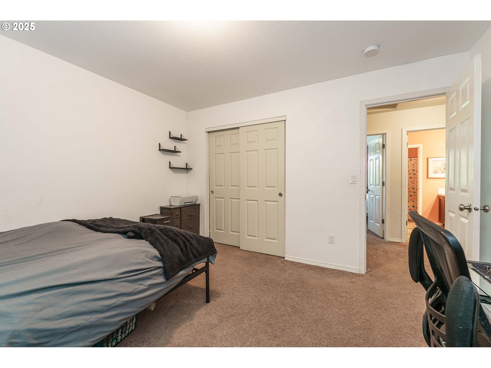 282 Karousel Lane Washougal, WA 98671 - Photo 33 of 42 a bedroom with a bed and a chandelier