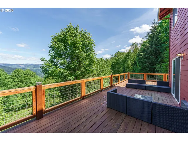 a view of deck with mountain view and wooden floor