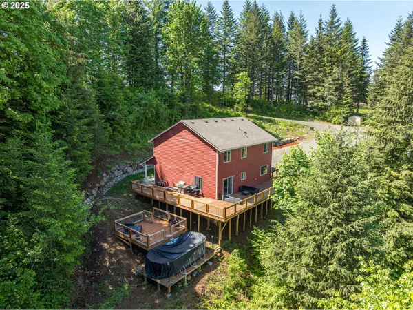 an aerial view of a house with swimming pool and garden view