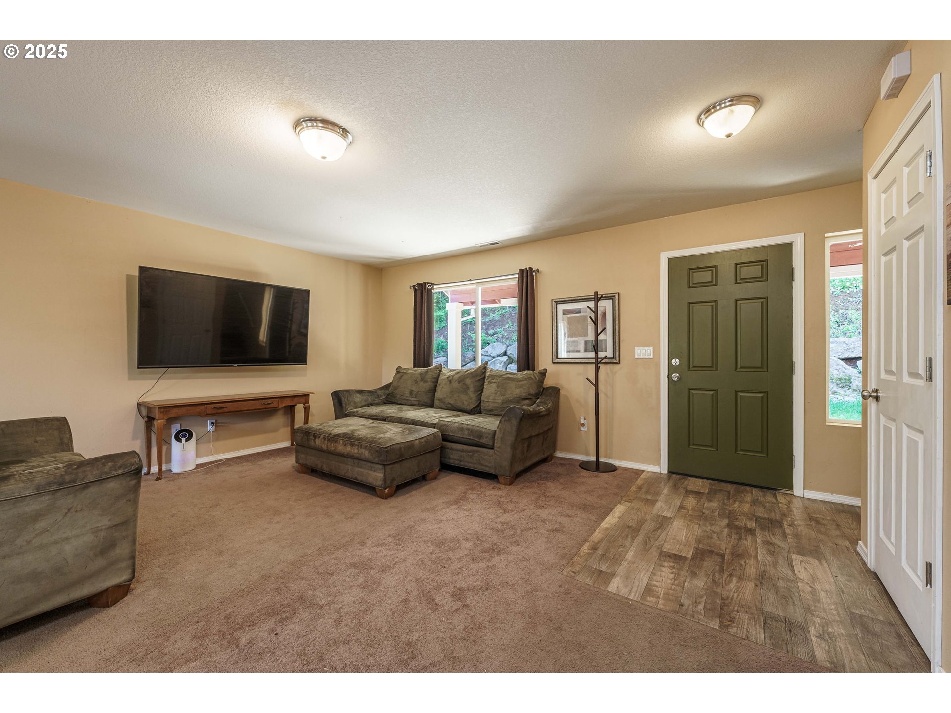 282 Karousel Lane Washougal, WA 98671 - Photo 6 of 42 a living room with furniture and a flat screen tv