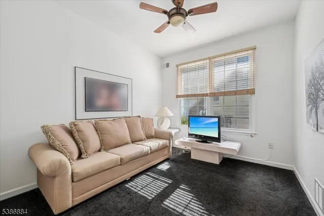 a bathroom with a double vanity sink toilet and shower