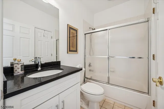 a living room with furniture potted plant and a window