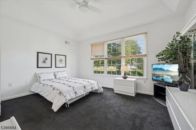 a bed room with a bed and a couch