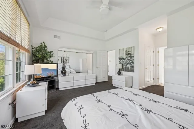 a bathroom with a double vanity sink a mirror and a bathtub