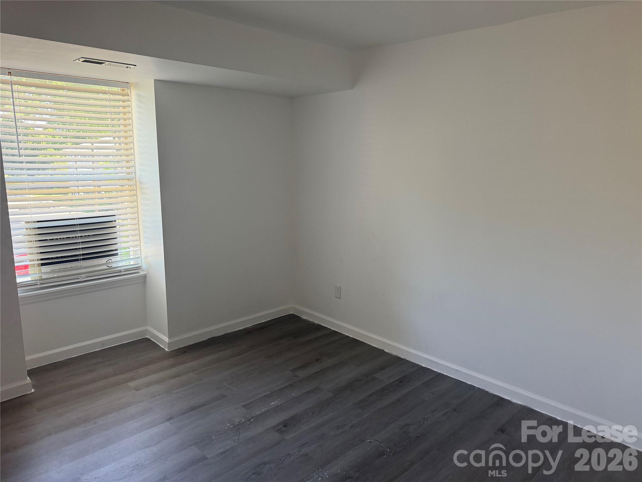 9333 Old Concord Road, Unit J Charlotte, NC 28213 - Photo 11 of 18 wooden floor in an empty room