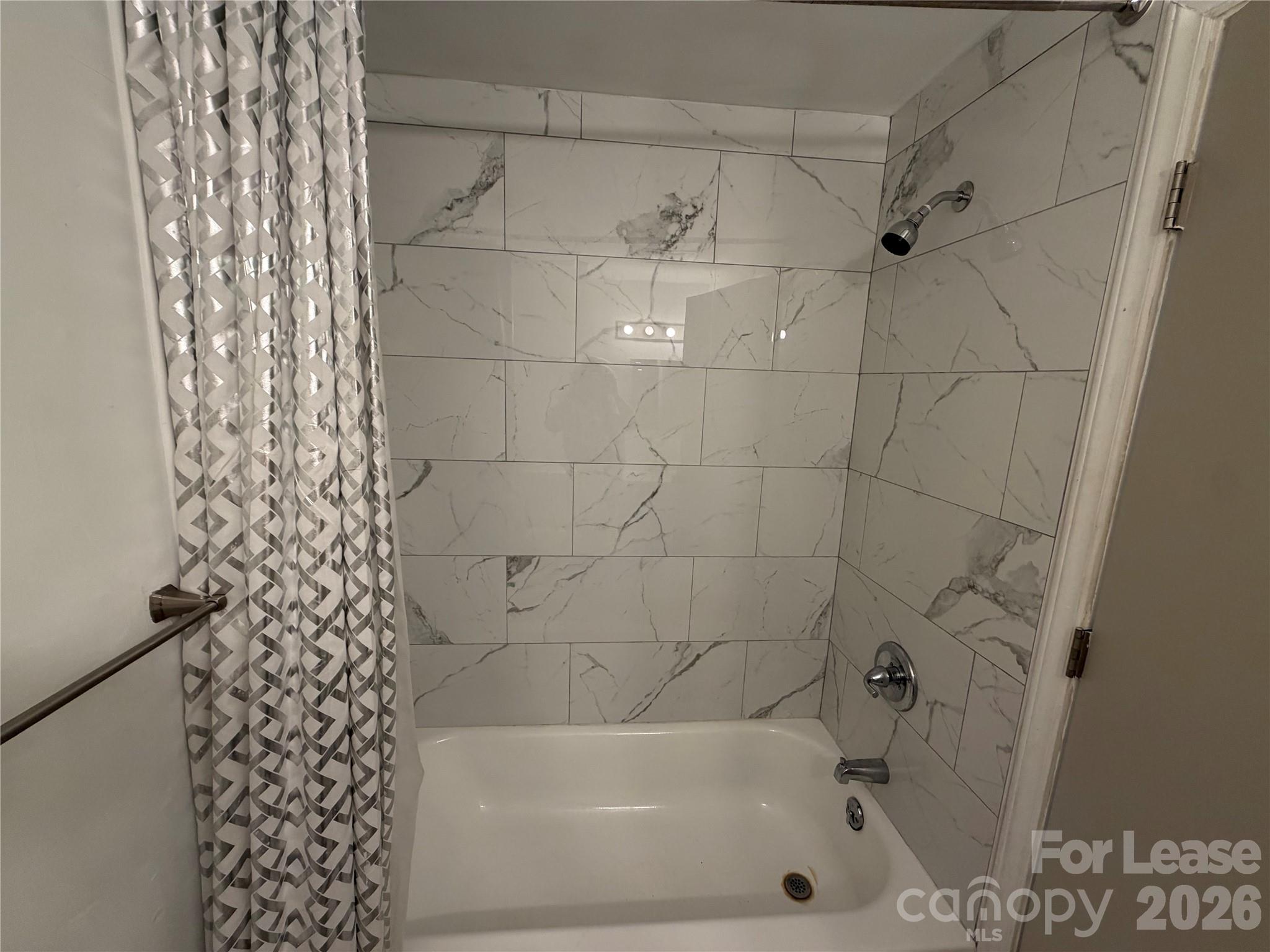 9333 Old Concord Road, Unit J Charlotte, NC 28213 - Photo 17 of 18 a bathroom with a bathtub