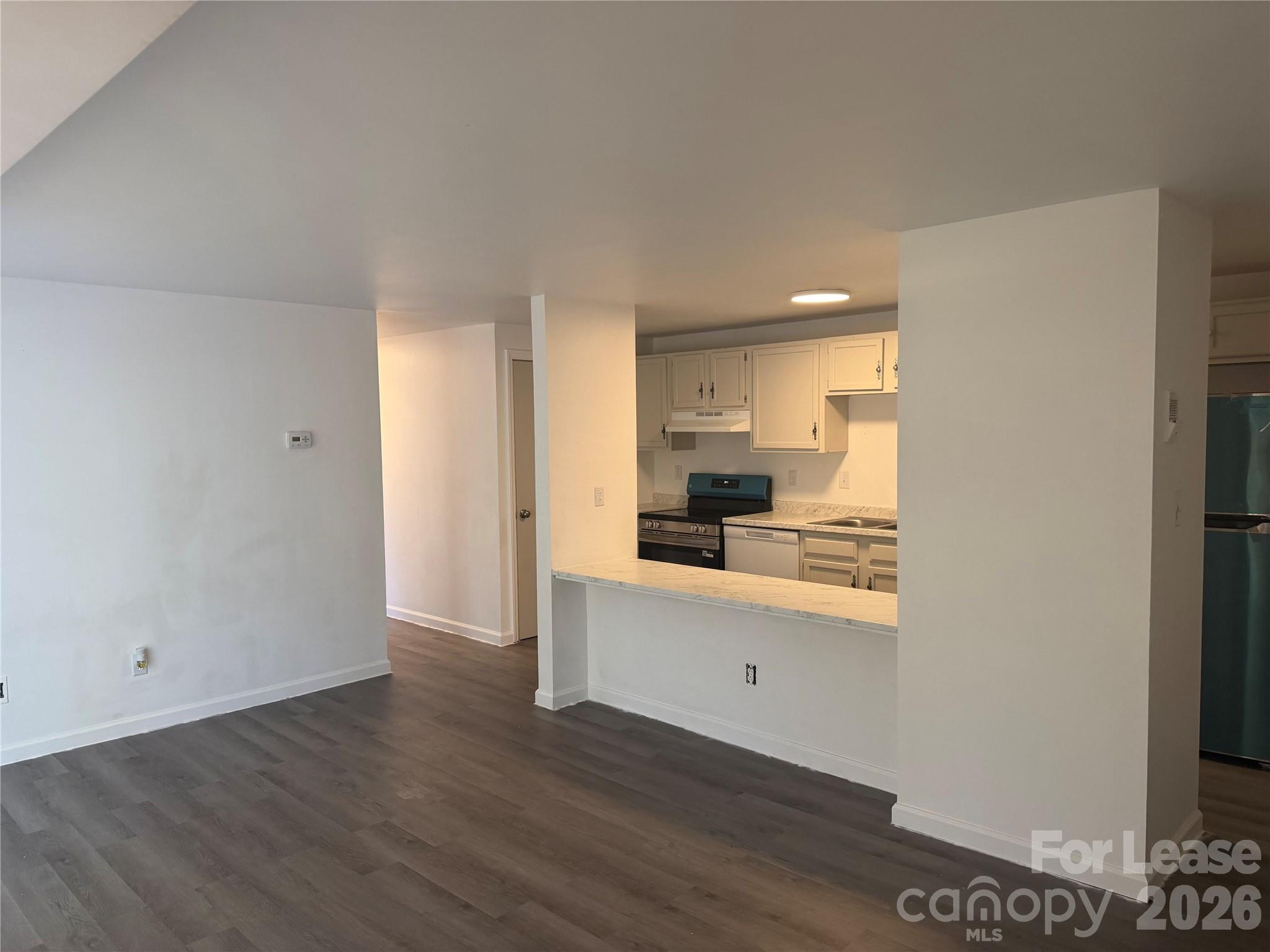 9333 Old Concord Road, Unit J Charlotte, NC 28213 - Photo 5 of 18 a view of a kitchen with wooden floor