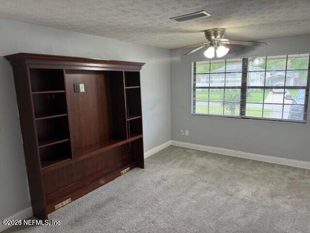5332 Colonial Avenue Jacksonville, FL 32210 - Photo 11 of 15 an empty room with chandelier closet and windows
