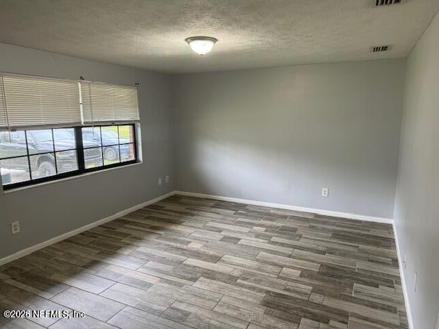 5332 Colonial Avenue Jacksonville, FL 32210 - Photo 2 of 15 en empty room with windows