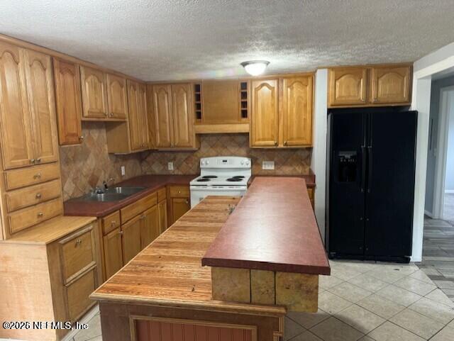 5332 Colonial Avenue Jacksonville, FL 32210 - Photo 4 of 15 a kitchen with stainless steel appliances granite countertop a stove a sink and a refrigerator