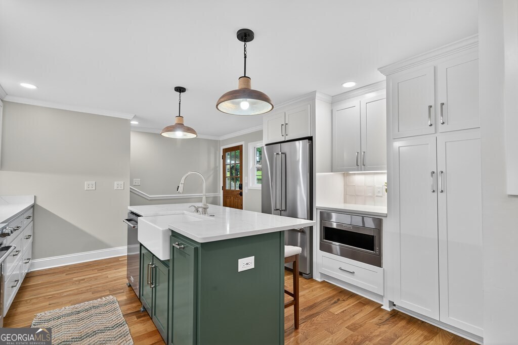 291 Power Point Milledgeville, GA 31061 - Photo 11 of 51 a kitchen with a refrigerator a sink and a stove top oven