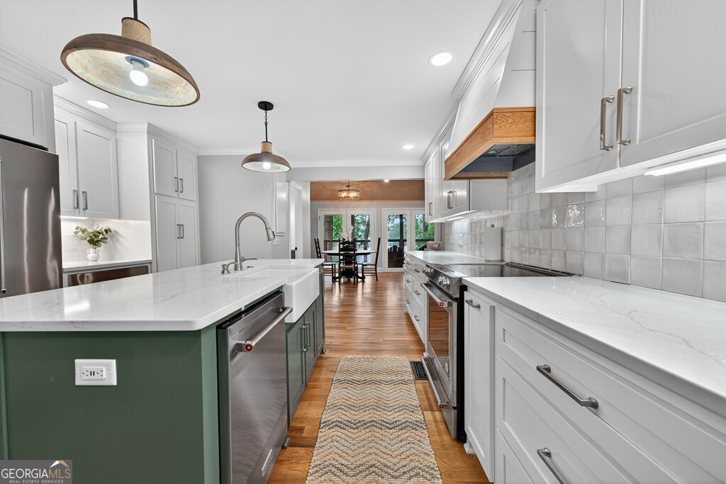 291 Power Point Milledgeville, GA 31061 - Photo 13 of 51 a kitchen with stainless steel appliances granite countertop a sink a stove and cabinets