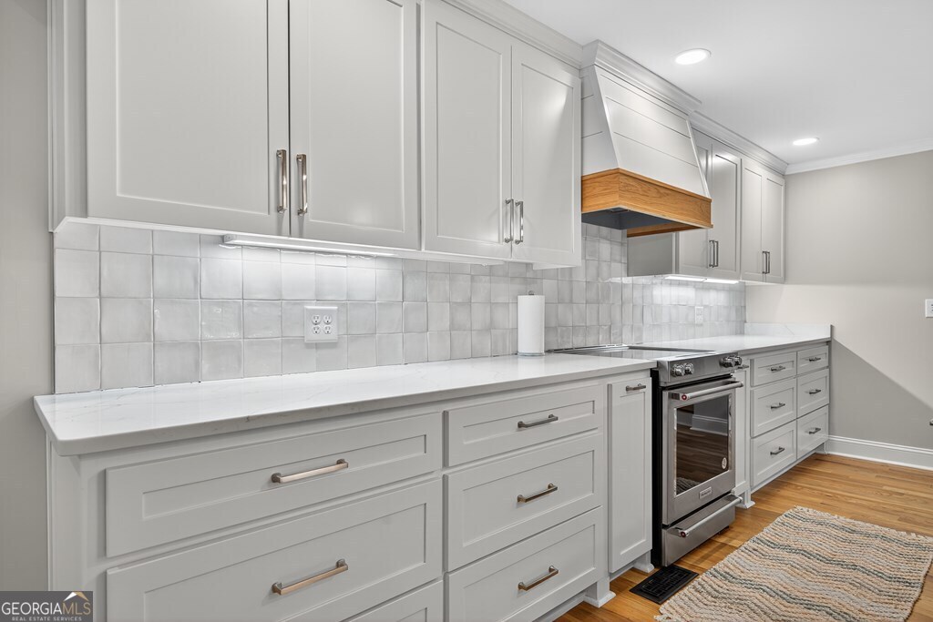 291 Power Point Milledgeville, GA 31061 - Photo 15 of 51 a kitchen with granite countertop white cabinets and white appliances