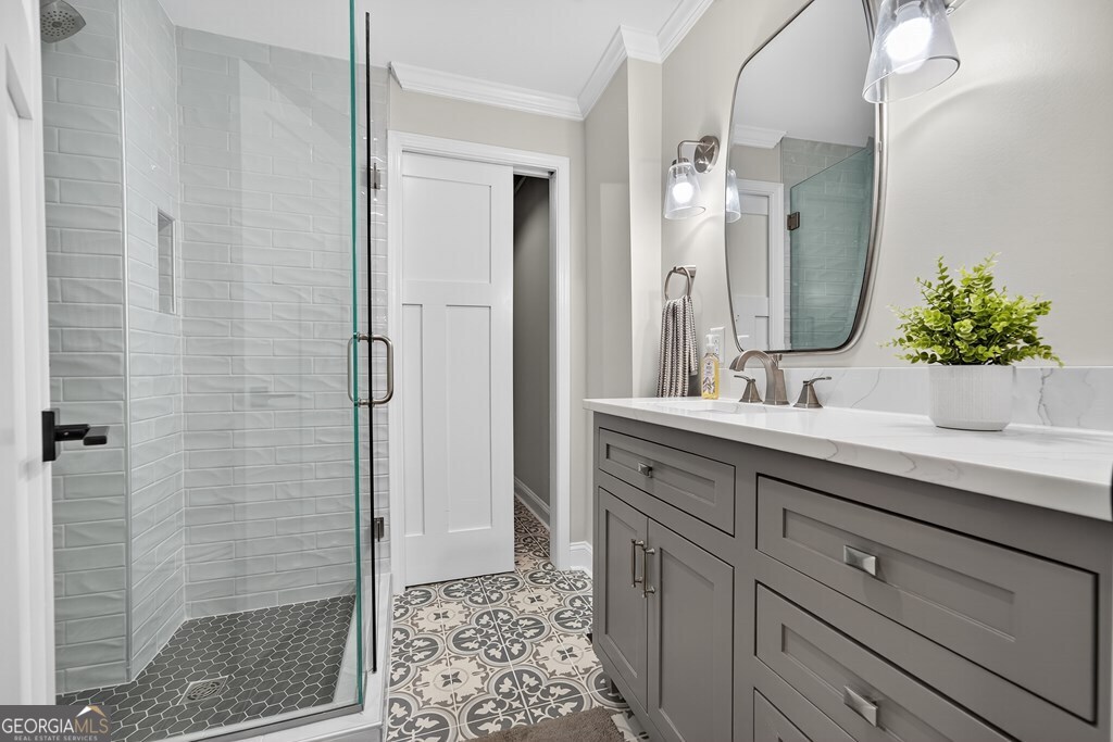 291 Power Point Milledgeville, GA 31061 - Photo 16 of 51 a bathroom with a shower sink and mirror