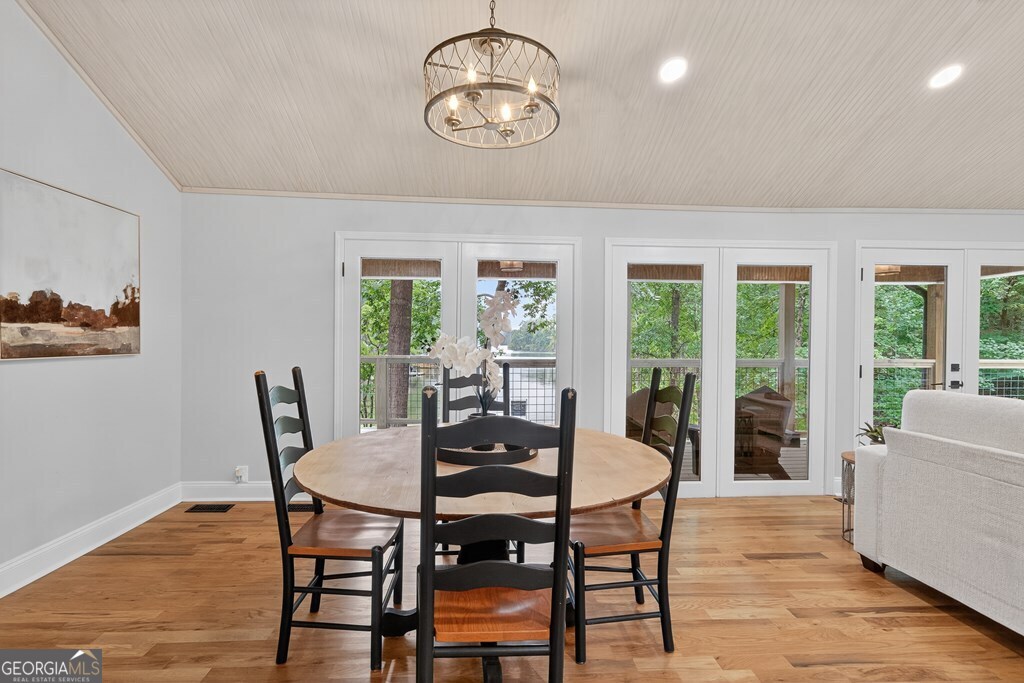 291 Power Point Milledgeville, GA 31061 - Photo 20 of 51 a dining room with furniture a chandelier and wooden floor