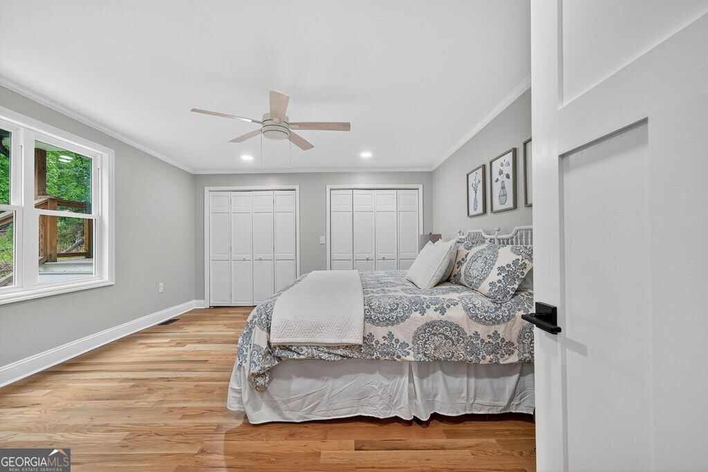 291 Power Point Milledgeville, GA 31061 - Photo 26 of 51 a bedroom with a bed and a ceiling fan