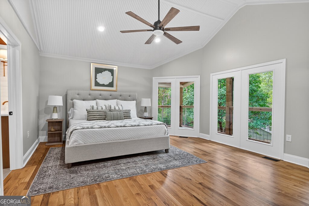 291 Power Point Milledgeville, GA 31061 - Photo 28 of 51 a spacious bedroom with a large bed and a large window