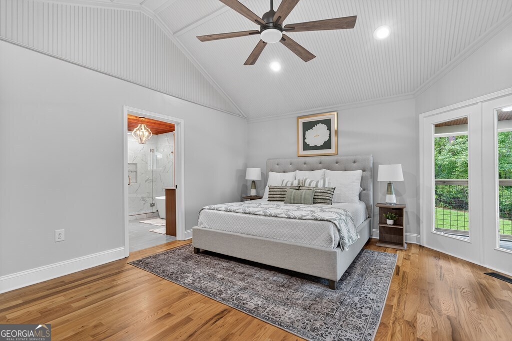 291 Power Point Milledgeville, GA 31061 - Photo 29 of 51 a spacious bedroom with a bed and a window