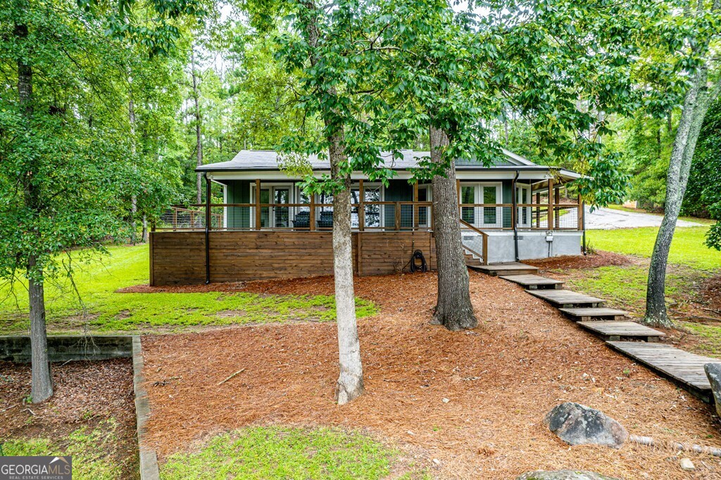 291 Power Point Milledgeville, GA 31061 - Photo 3 of 51 a front view of a house with a yard