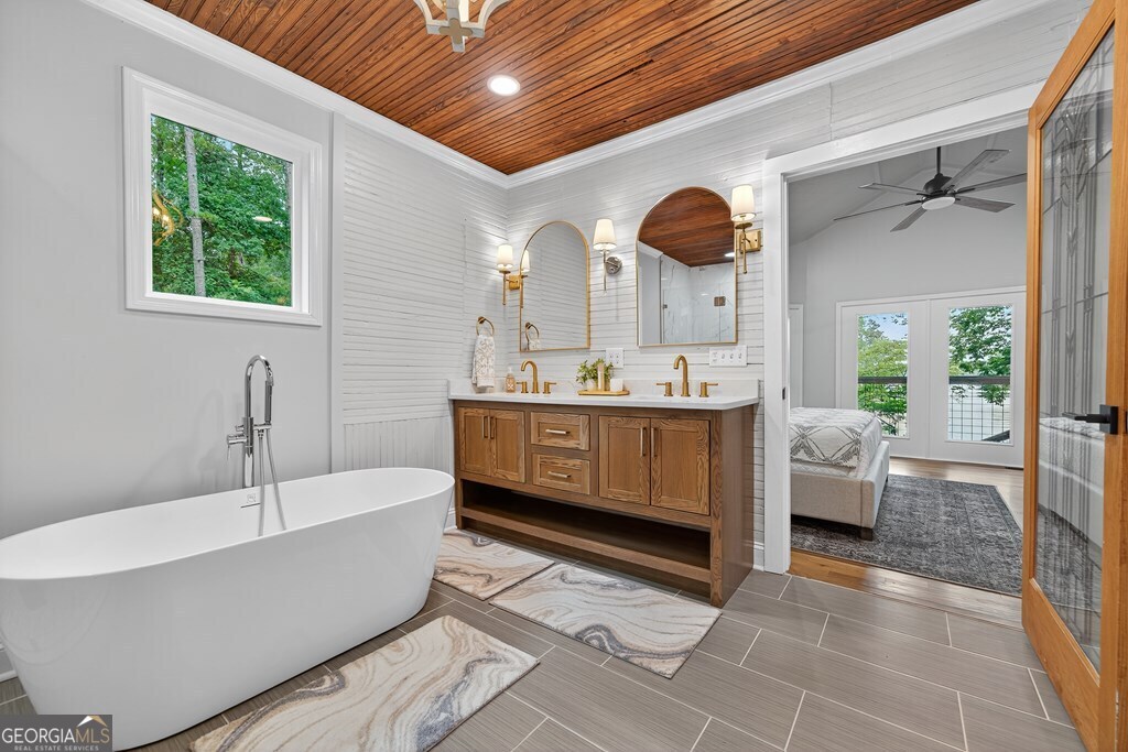 291 Power Point Milledgeville, GA 31061 - Photo 33 of 51 a bathroom with a sink a bathtub and a window