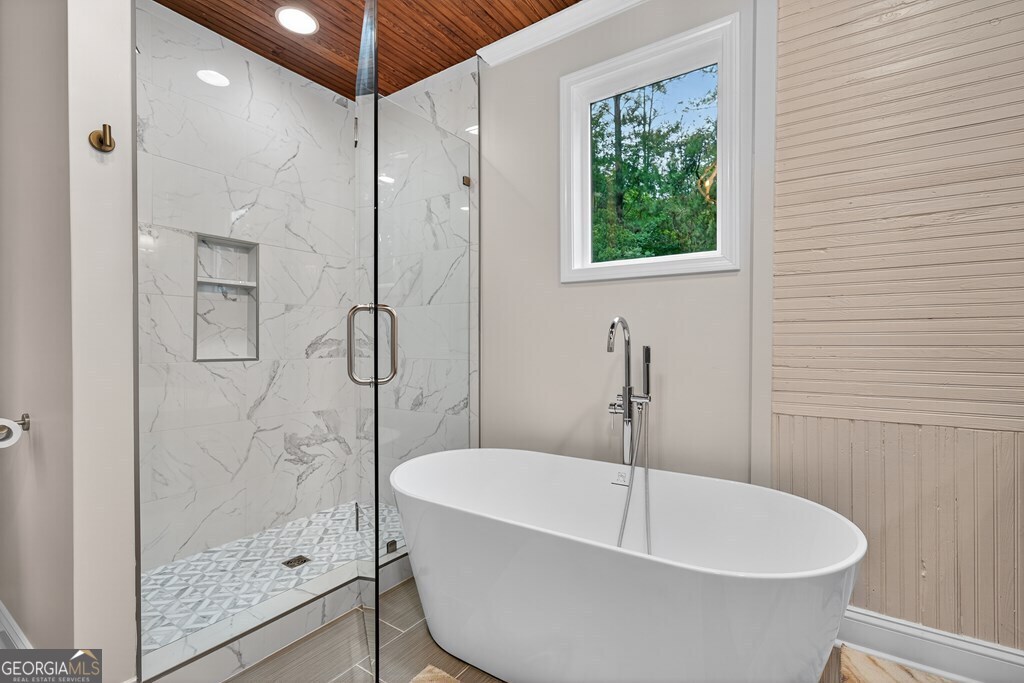 291 Power Point Milledgeville, GA 31061 - Photo 35 of 51 a bathroom with a white bath tub a shower and a sink