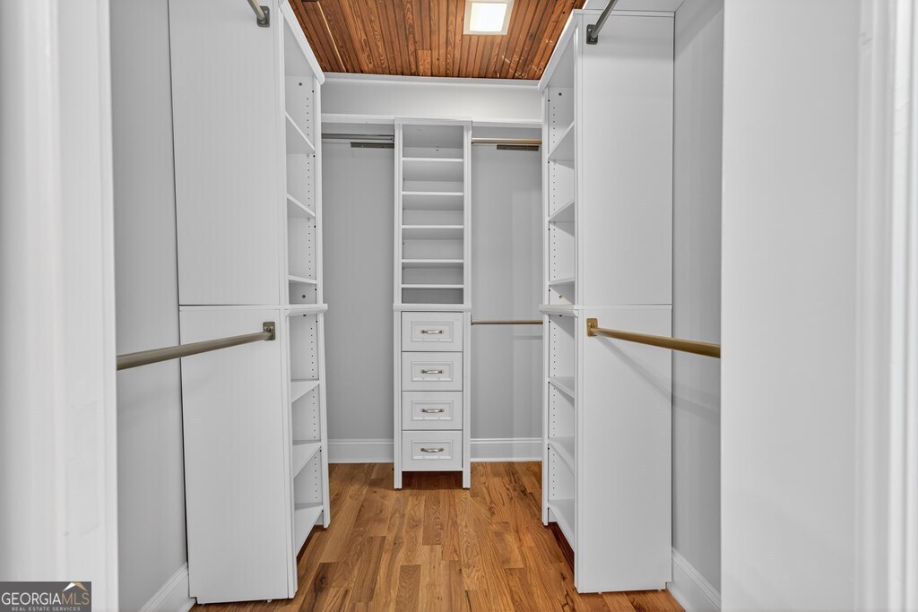 291 Power Point Milledgeville, GA 31061 - Photo 36 of 51 a view of walk in closet with wooden floor